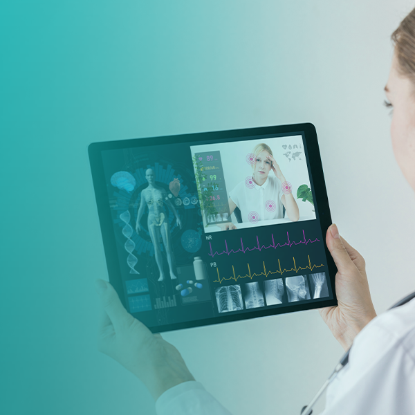A nurse looking at tablet that is managed and secured by SOTI ONE Platform